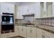 Modern kitchen with stainless steel appliances and granite countertops at 4222 E Mclellan Cir # 7, Mesa, AZ 85205