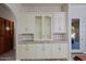 Butlers pantry with glass-front cabinets and granite countertops at 4222 E Mclellan Cir # 7, Mesa, AZ 85205