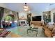 Living room boasts hardwood floors, fireplace, and backyard access at 4222 E Mclellan Cir # 7, Mesa, AZ 85205