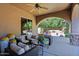 Covered patio with seating area, ceiling fan, and views of the backyard at 4222 E Mclellan Cir # 7, Mesa, AZ 85205