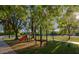 playground with swings, slides, and play structures at 4222 E Mclellan Cir # 7, Mesa, AZ 85205
