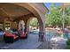 Covered patio with seating overlooking a sparkling pool at 4222 E Mclellan Cir # 7, Mesa, AZ 85205