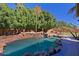 Resort-style pool with a waterfall feature at 4222 E Mclellan Cir # 7, Mesa, AZ 85205
