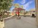Landscaped backyard with pergola, fire pit, and patio at 4350 E Longhorn St, San Tan Valley, AZ 85140