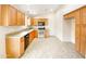 Kitchen with wood cabinets, granite counters, and stainless steel appliances at 4350 E Longhorn St, San Tan Valley, AZ 85140