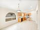 Kitchen with wood cabinets and an arched window at 4350 E Longhorn St, San Tan Valley, AZ 85140