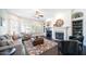 Bright living room with a fireplace and built-in shelving at 4400 S Oleander Dr, Chandler, AZ 85248