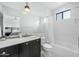 Clean bathroom with a shower/tub combo and marble countertop at 4515 N 36Th Way, Phoenix, AZ 85018