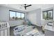 Bedroom with crib, glider, and plenty of natural light at 4515 N 36Th Way, Phoenix, AZ 85018
