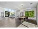 Open concept dining area with a modern fireplace and large windows at 4515 N 36Th Way, Phoenix, AZ 85018
