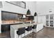 Contemporary kitchen with a large island and brick backsplash at 4515 N 36Th Way, Phoenix, AZ 85018