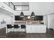 Modern kitchen featuring a large island and dark cabinetry at 4515 N 36Th Way, Phoenix, AZ 85018