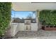 Modern outdoor kitchen featuring a built-in grill and sleek cabinetry at 4515 N 36Th Way, Phoenix, AZ 85018