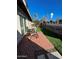 Spacious backyard with patio and artificial turf at 524 W Fairway Dr # 12, Mesa, AZ 85201