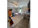 Cozy bedroom with brick accent wall and hardwood floors at 524 W Fairway Dr # 12, Mesa, AZ 85201