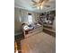 Bedroom with a twin bed, built-in shelving, and a ceiling fan at 524 W Fairway Dr # 12, Mesa, AZ 85201