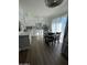 Updated kitchen with white cabinets, mosaic backsplash, and wood flooring at 524 W Fairway Dr # 12, Mesa, AZ 85201