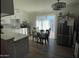 Bright kitchen with white cabinets, stainless steel appliances, and an island at 524 W Fairway Dr # 12, Mesa, AZ 85201