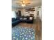 Spacious living room with sectional sofa and wood-look flooring at 524 W Fairway Dr # 12, Mesa, AZ 85201