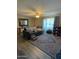 Spacious living room with hardwood floors and decorative rug at 524 W Fairway Dr # 13, Mesa, AZ 85201