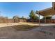 Fenced backyard, covered patio, and grassy area at 5518 W Mercury Way, Chandler, AZ 85226