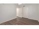 Bedroom with wood-look floors and mirrored closet doors at 5518 W Mercury Way, Chandler, AZ 85226