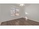 Bright bedroom with wood-look flooring and ceiling fan at 5518 W Mercury Way, Chandler, AZ 85226
