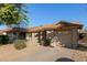 Tan house with a two-car garage and rock landscaping at 5518 W Mercury Way, Chandler, AZ 85226