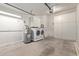 Garage with washer, dryer, and ample storage at 5518 W Mercury Way, Chandler, AZ 85226