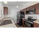 Modern kitchen with stainless steel appliances and granite counters at 5518 W Mercury Way, Chandler, AZ 85226