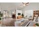 Bright living room with hardwood floors, comfortable seating, and a dining area at 5518 W Mercury Way, Chandler, AZ 85226