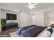 Spacious main bedroom with a large TV and ample closet space at 5518 W Mercury Way, Chandler, AZ 85226