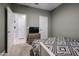 Well-lit bedroom with carpet flooring and built-in dresser at 5523 W Chuck Box Rd, Laveen, AZ 85339