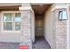 House entrance with brick columns and a private residence sign at 5523 W Chuck Box Rd, Laveen, AZ 85339