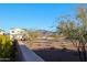 View of neighborhood homes and a mountain in the background at 5523 W Chuck Box Rd, Laveen, AZ 85339