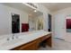 Bathroom with double sinks, large mirror, and shower/tub combo at 5731 W Aster Dr, Glendale, AZ 85304
