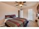 Bright bedroom with ceiling fan and double bed at 5731 W Aster Dr, Glendale, AZ 85304