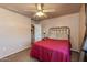 Cozy bedroom with ceiling fan and double bed at 5731 W Aster Dr, Glendale, AZ 85304