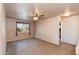 Bright bedroom with carpeted floor and ceiling fan at 5731 W Aster Dr, Glendale, AZ 85304