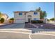 Two-story house with a two-car garage and landscaped front yard at 5731 W Aster Dr, Glendale, AZ 85304