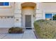 Front entrance with security door and well-maintained landscaping at 5731 W Aster Dr, Glendale, AZ 85304
