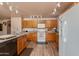 Spacious kitchen with island, wood cabinets, and modern appliances at 5731 W Aster Dr, Glendale, AZ 85304
