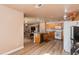 Open concept kitchen with island and dining area at 5731 W Aster Dr, Glendale, AZ 85304