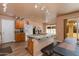 Kitchen with island, wood cabinets, and an eat-in area at 5731 W Aster Dr, Glendale, AZ 85304