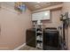 Bright laundry room, washer, dryer, and ample storage at 5731 W Aster Dr, Glendale, AZ 85304