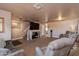 Bright living room with ample seating and a large screen TV at 5731 W Aster Dr, Glendale, AZ 85304