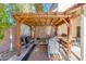 Backyard pergola with seating and built-in fire pit at 5731 W Aster Dr, Glendale, AZ 85304