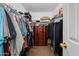 Large walk-in closet with ample shelving and hanging space at 5731 W Aster Dr, Glendale, AZ 85304