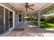 Covered patio with flagstone flooring and backyard access at 6113 W Desert Hills Dr, Glendale, AZ 85304