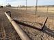 Photo detailing fencing around the arena and open space of horse property at 64 N Desert Ln, Coolidge, AZ 85128